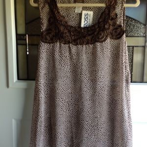 Sheer polka dot top with rosettes at neckline